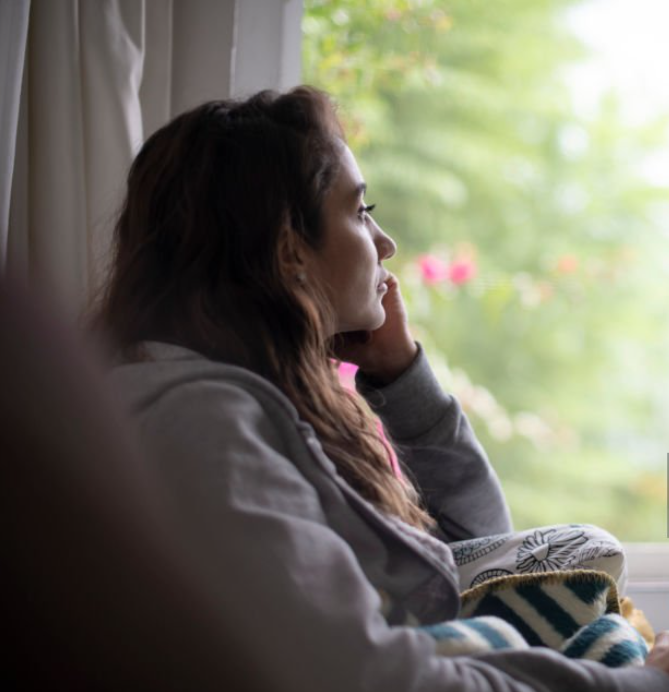 Girl looking out the window